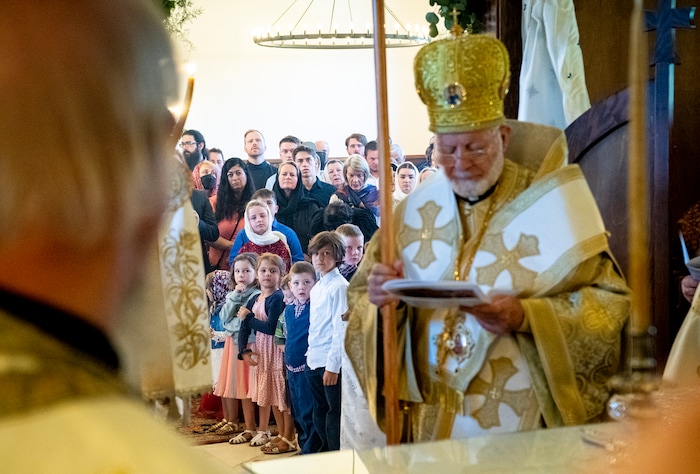 (Isaac Hale | Special to The Tribune) Members of the congregation look on as Metropolitan Joseph, leader of the Antiochian Orthodox Christian Archdiocese of North America, and clergy participate in the vesting of the holy table during a consecration service for St. Xenia Orthodox Church in Payson on Saturday, July 16, 2022.