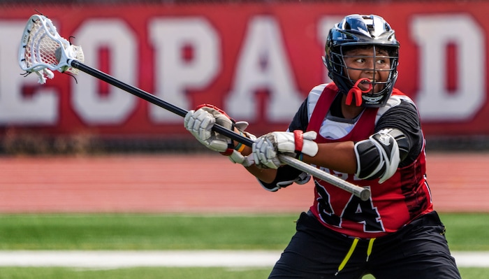 (Rick Egan | The Salt Lake Tribune)  Edward Tonga runs drills, during East youth lacrosse practice, on Wednesday, June 22, 2022.