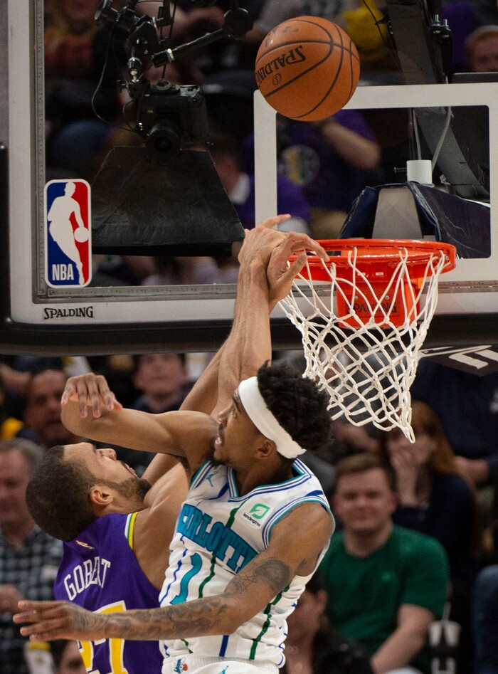 (Rick Egan  |  The Salt Lake Tribune)   Charlotte Hornets guard Malik Monk (1) is called for a personal foul, as he stops Utah Jazz center Rudy Gobert (27) from scoring, in NBA action between the Utah Jazz and the Charlotte Hornets, in Salt Lake City,  Monday, April 1, 2019.