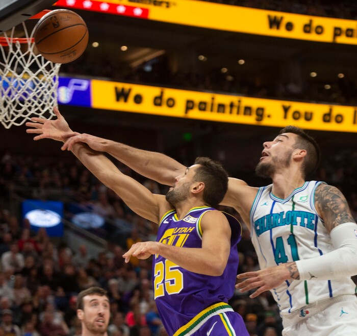 (Rick Egan  |  The Salt Lake Tribune)   Utah Jazz guard Raul Neto (25) takes the ball to the basket as Charlotte Hornets center Willy Hernangomez (41) defends, in NBA action between the Utah Jazz and the Charlotte Hornets, in Salt Lake City,  Monday, April 1, 2019.