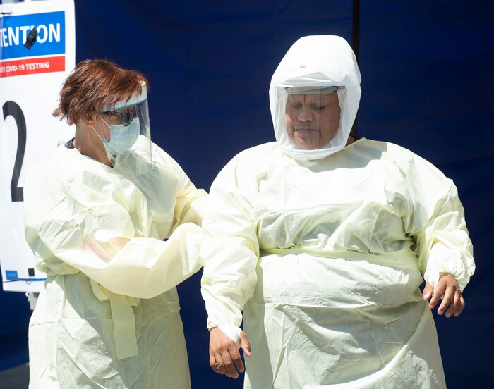 (Rick Egan  |  The Salt Lake Tribune)   Medical assists prepare for the next patient, at the Intermountain Healthcare Coronavirus Mobile Testing Unit at Utah Valley Hospital in Provo, Friday May 8, 2020.