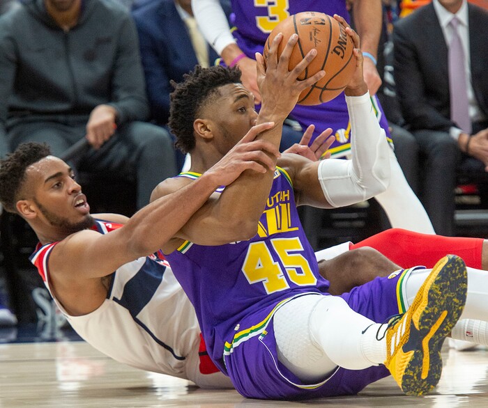 (Rick Egan  |  The Salt Lake Tribune)        Washington Wizards forward Troy Brown Jr. (6) goes for a loose ball along with Utah Jazz guard Donovan Mitchell (45), in NBA action between the Utah Jazz and the Washington Wizards, in Salt Lake City, Friday, March 29, 2019.