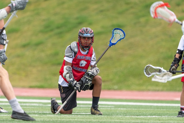 (Rick Egan | The Salt Lake Tribune)  Lolo Angilau watches the action as he takes a break, in East youth lacrosse practice, on Wednesday, June 22, 2022.