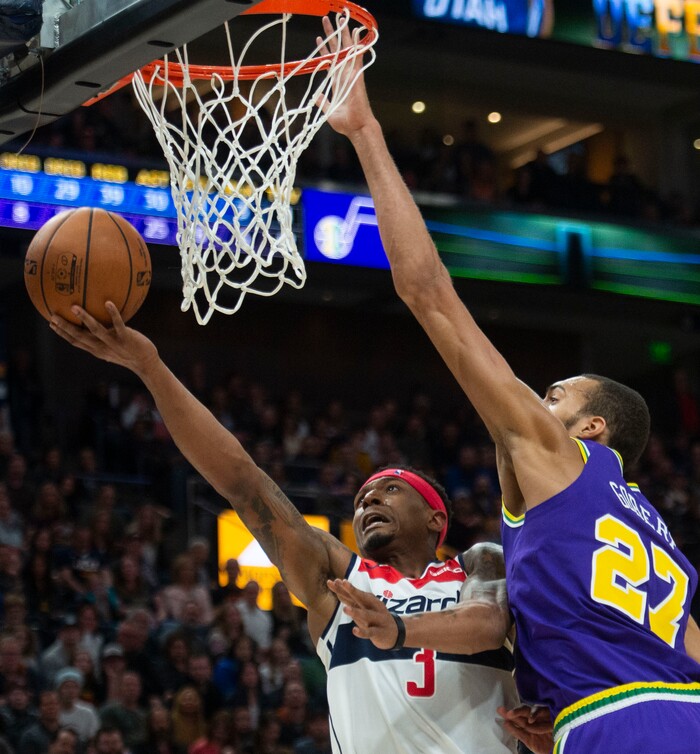 (Rick Egan  |  The Salt Lake Tribune)        Washington Wizards guard Bradley Beal (3) takes the ball do the basket, as Utah Jazz center Rudy Gobert (27) defends, in NBA action between the Utah Jazz and the Washington Wizards, in Salt Lake City, Friday, March 29, 2019.