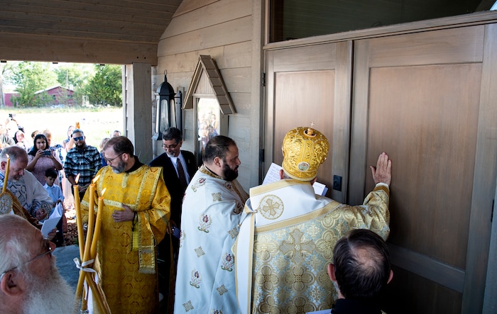 (Isaac Hale | Special to The Tribune) Metropolitan Joseph, leader of the Antiochian Orthodox Christian Archdiocese of North America, knocks three times on the door of the church during a consecration service for St. Xenia Orthodox Church in Payson on Saturday, July 16, 2022.