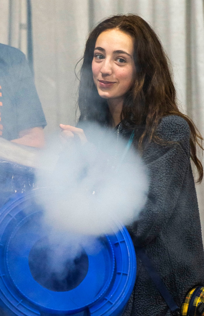 (Rick Egan  |  The Salt Lake Tribune)         Liberty Gardner,  from Alta High makes smoke rings, during at experiment during the SheTech Explorer Day event, at the Mountain America Expo Center in Sandy, Tuesday, April 9, 2019.