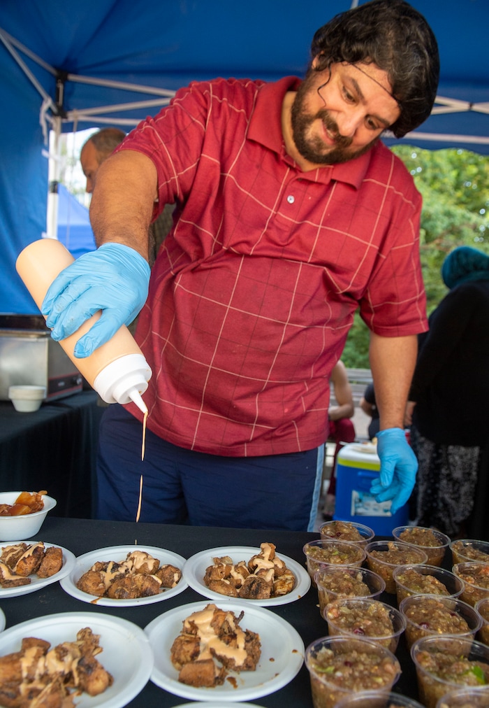 (Rick Egan  |  The Salt Lake Tribune)     Chef Noor Al Sham specializes inShawarma and Syrian cuisine, in his booth at the Gallivan Center, as Salt Lake City's Spice Kitchen Incubator program serves a variety of international cuisine at the welcome party for the United Nations Civil Society Conference, Sunday, Aug. 25, 2019.