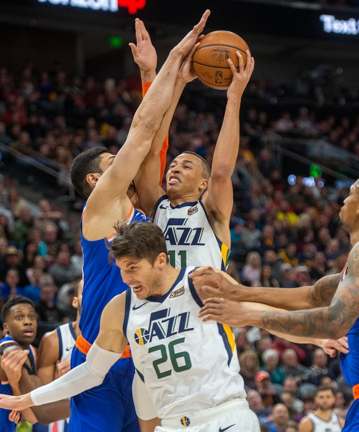 (Rick Egan  |  The Salt Lake Tribune)  Utah Jazz guard Dante Exum (11) shoots over New York Knicks center Enes Kanter (00), in NBA action between Utah Jazz and New York Knicks, in Salt Lake City, Saturday, Dec. 29, 2018.
