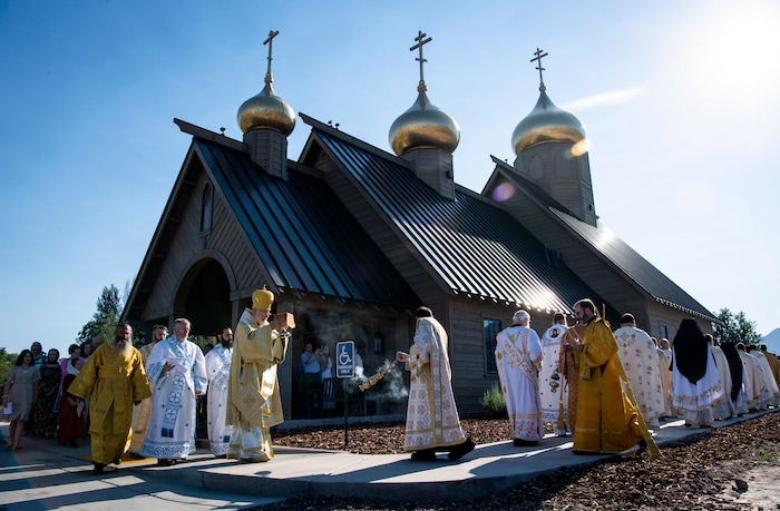 (Isaac Hale | Special to The Tribune) Metropolitan Joseph, leader of the Antiochian Orthodox Christian Archdiocese of North America, along with clergy and members of the congregation process around the church during a consecration service for St. Xenia Orthodox Church in Payson on Saturday, July 16, 2022.