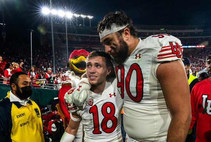 (Rick Egan | The Salt Lake Tribune)  Utah Utes wide receiver Britain Covey (18) and Utah Utes defensive tackle Devin Kaufusi (90) walk off the field after narrowly losing to Ohio State in the Rose Bowl in Pasadena, CA, on Saturday, January 1, 2022.