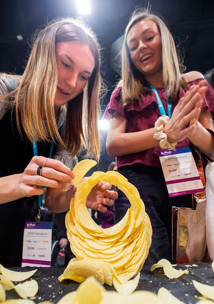(Rick Egan  |  The Salt Lake Tribune)         Claire Cannady and Hanna Phelps build an arch out of potato chips, during the SheTech Explorer Day event, at the Mountain America Expo Center in Sandy, Tuesday, April 9, 2019.