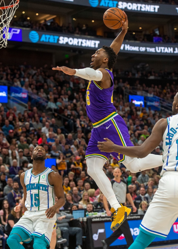 (Rick Egan  |  The Salt Lake Tribune)   Utah Jazz guard Donovan Mitchell (45) dunks the ball, in NBA action between the Utah Jazz and the Charlotte Hornets, in Salt Lake City,  Monday, April 1, 2019.