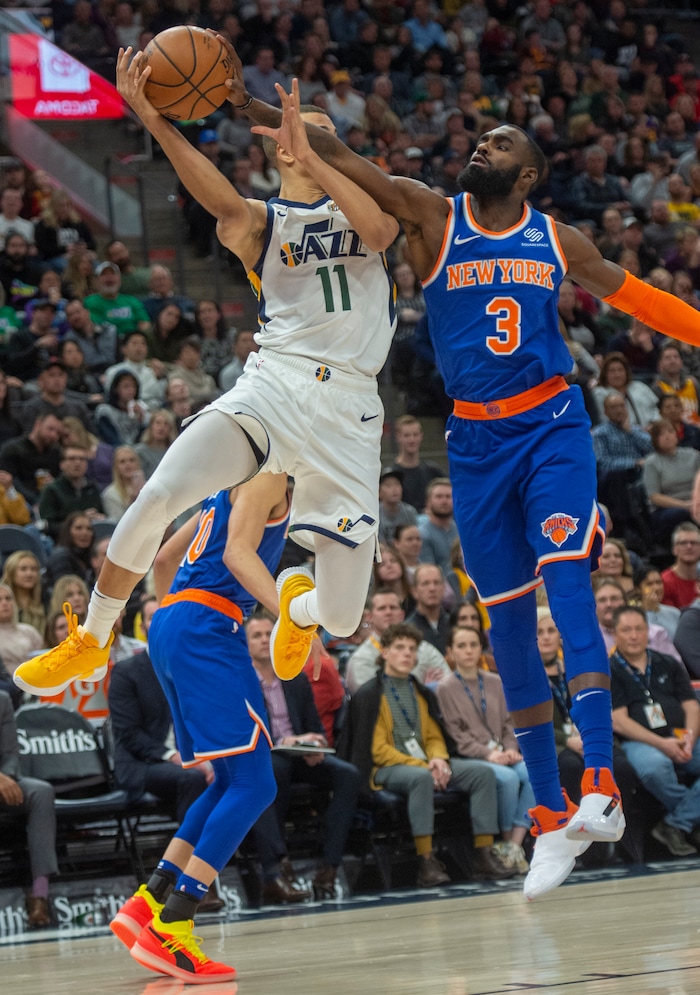 (Rick Egan  |  The Salt Lake Tribune)  Utah Jazz guard Dante Exum (11) tries to throw a pass as New York Knicks guard Tim Hardaway Jr. (3) defends, in NBA action between Utah Jazz and New York Knicks, in Salt Lake City, Saturday, Dec. 29, 2018.