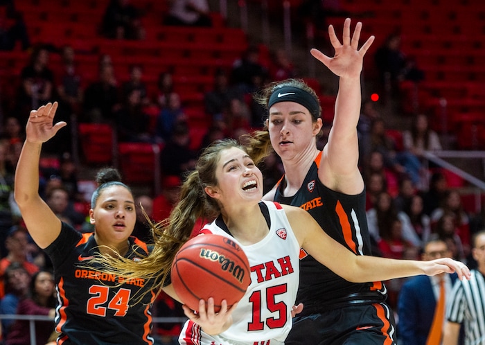 (Rick Egan  |  The Salt Lake Tribune)     Utah Utes guard Kemery Martin (15) takes the ball to the hoop, as Oregon State guard Destiny Slocum (24) and  forward Kennedy Brown (42) defend for the Beavers, in PAC-12 basketball action between the Utah Utes and the Oregon State Beavers at the Jon M. Huntsman Center, Saturday, Feb. 1, 2020.