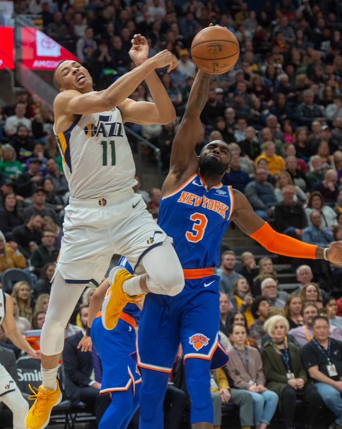 (Rick Egan  |  The Salt Lake Tribune)  Utah Jazz guard Dante Exum (11) tries to throw a pass as New York Knicks guard Tim Hardaway Jr. (3) defends, in NBA action between Utah Jazz and New York Knicks, in Salt Lake City, Saturday, Dec. 29, 2018.