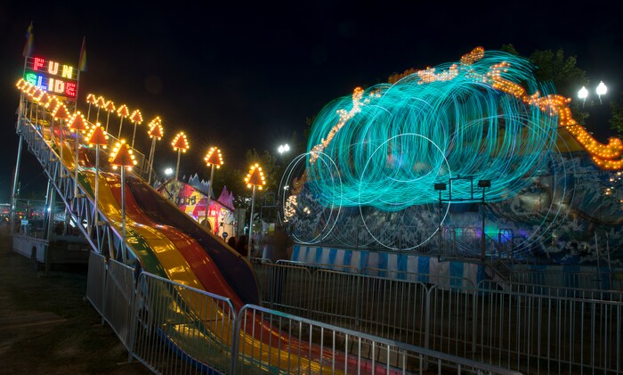 (Rick Egan  |  The Salt Lake Tribune)   The Fun Slide and Moby Dick light up the midway at the Utah State Fair, on a busy Monday evening , Sept. 10, 2018.