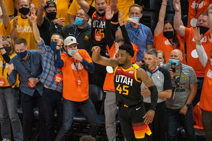 (Rick Egan | The Salt Lake Tribune) Utah Jazz fans react as Utah Jazz guard Donovan Mitchell (45) scores his 27th point in the first half of the game, with a 3-point shot in the final seconds of the first half, in second round playoff action in game 2 between the Utah Jazz and the LA Clippers, at Vivint Arena, on Thursday, June 10, 2021.