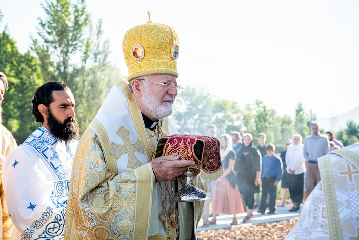 (Isaac Hale | Special to The Tribune) Metropolitan Joseph, leader of the Antiochian Orthodox Christian Archdiocese of North America, along with clergy and members of the congregation process around the church during a consecration service for St. Xenia Orthodox Church in Payson on Saturday, July 16, 2022.