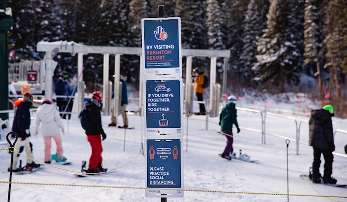 (Francisco Kjolseth  | The Salt Lake Tribune) Mask mandates are enforced as people take to the slopes at Brighton Resort in Big Cottonwood Canyon on Tuesday, Jan. 5, 2020. Skiers were down during the holidays overall due to the low snow levels and the pandemic. Most out of staters kept their reservations, but some locals stayed away, waiting for better conditions.