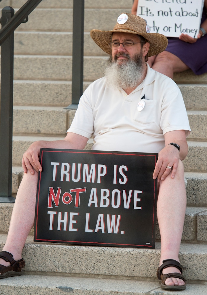 (Rick Egan  |  The Salt Lake Tribune)     Jack Gavin, West Caldwell NJ, listens to speakers at the Confront Corruption:Demand Democracy vigil on the steps of the Utah State Capitol, Wednesday. Salt Lake City joined more than 110 vigils nationwide to stand against corruption in the United States, July 18, 2018.