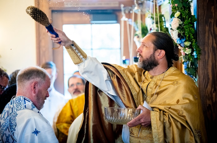 (Isaac Hale | Special to The Tribune) Priests, deacons and subdeacons take turns dousing the church and congregation in holy water during a consecration service for St. Xenia Orthodox Church in Payson on Saturday, July 16, 2022.