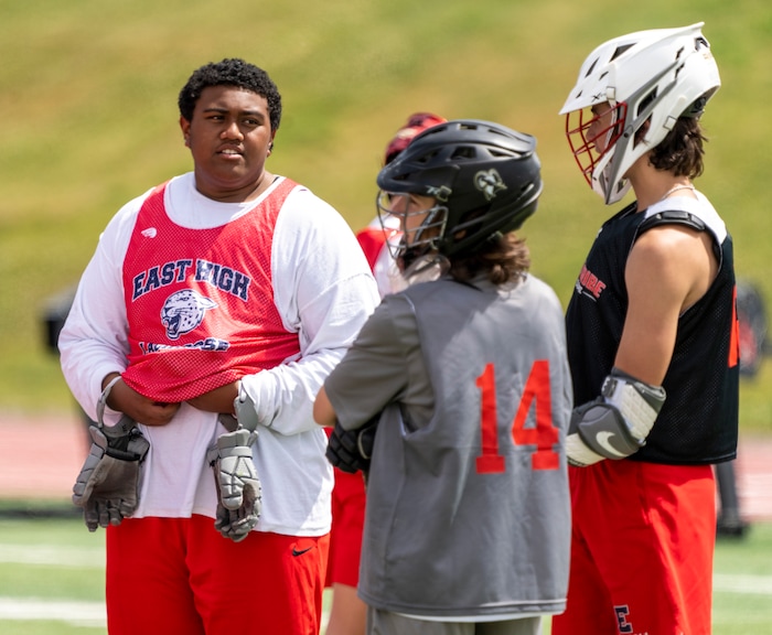 (Rick Egan | The Salt Lake Tribune)  Tui Tonga joke with team mates, during East youth lacrosse practice, on Wednesday, June 22, 2022. 