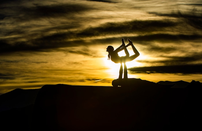 (Rick Egan | The Salt Lake Tribune)   Chris Knoles and Roxy Christensen do Acro Yoga on top of the Sun Tunnels, as revelers celebrate a unique winter solstice near the famed Sun Tunnels sculpture in remote Utah's Great Basin Desert, on Monday, Dec. 21, 2020. For the first time in 800 years, Saturn and Jupiter align to create a single, bright point of light known as the "Christmas Star."