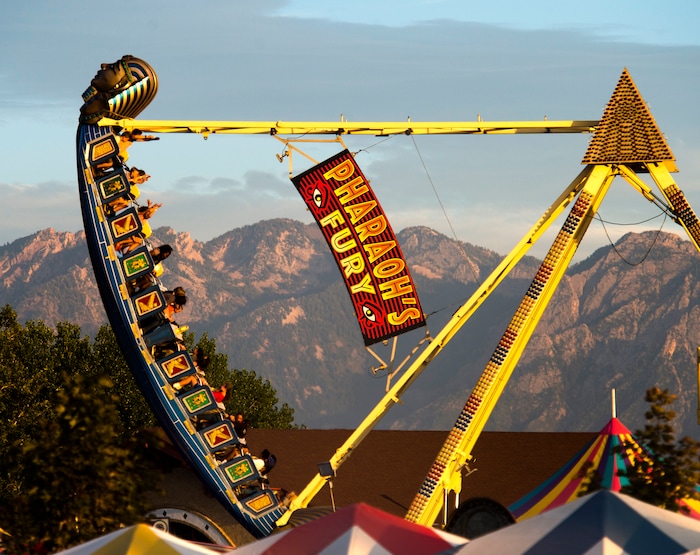 (Rick Egan  |  The Salt Lake Tribune)   The ride Pharaoh's Fury thrills the crowd at the Utah State Fair, on a busy Monday,  Sept. 10, 2018.
