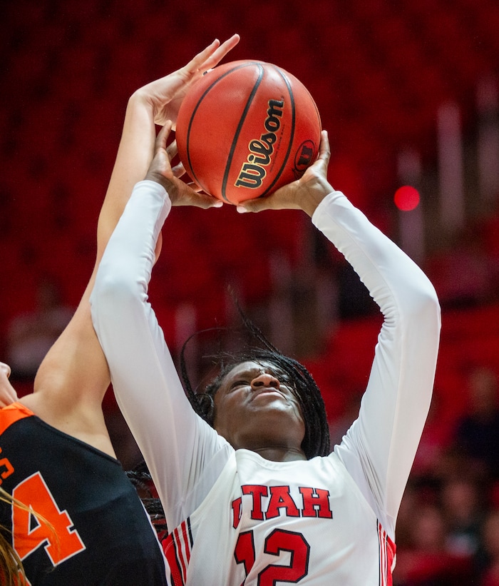 (Rick Egan  |  The Salt Lake Tribune)     Utah Utes forward Lola Pendande (12) take s ascot as Oregon State Beavers forward Taylor Jones (44) defends, in PAC-12 basketball action between the Utah Utes and the Oregon State Beavers at the Jon M. Huntsman Center, Saturday, Feb. 1, 2020.