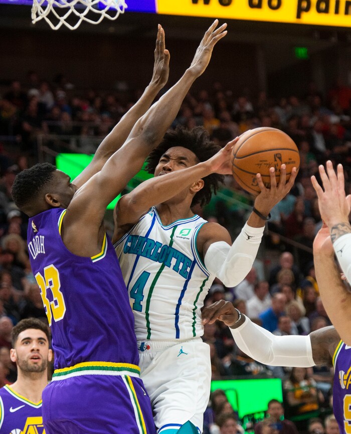 (Rick Egan  |  The Salt Lake Tribune)   Charlotte Hornets guard Devonte' Graham (4) shoots as Utah Jazz center Rudy Gobert (27) defends, in NBA action between the Utah Jazz and the Charlotte Hornets, in Salt Lake City,  Monday, April 1, 2019.