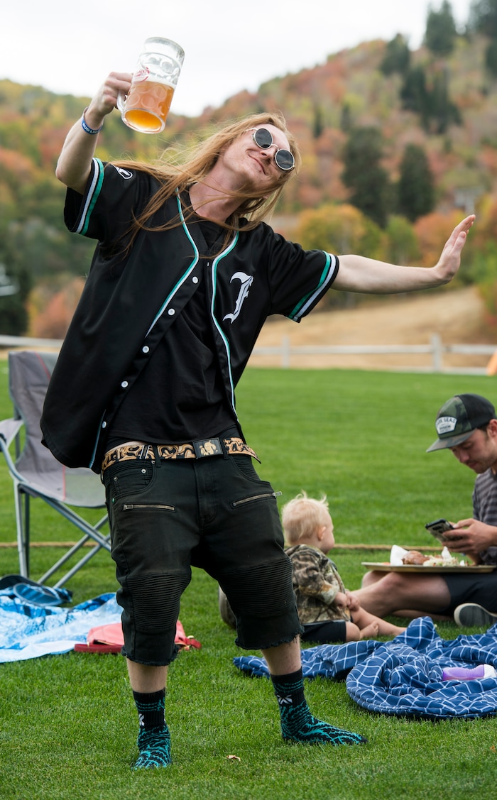(Rick Egan  |  The Salt Lake Tribune)   Chance Rasmussen, from Ogden, dances to the music of the band Night Marcher, at the Blues, Brews & BBQ at Snowbasin resort  Sunday, Sept. 23, 2018.