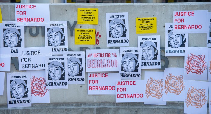 (Rick Egan  |  The Salt Lake Tribune)      Protesters tape signs to the sign at the Salt Lake District Attorney's office, during a Justice for Bernardo demonstration, in Salt Lake City, Tuesday, July 7, 2020.