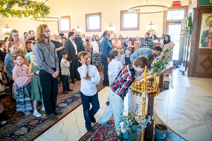 (Isaac Hale | Special to The Tribune) The congregation takes part in veneration during a consecration service for St. Xenia Orthodox Church in Payson on Saturday, July 16, 2022.