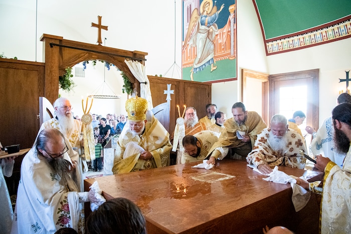 (Isaac Hale | Special to The Tribune) Metropolitan Joseph, leader of the Antiochian Orthodox Christian Archdiocese of North America, washes and dries the holy table with other clergy during a consecration service for St. Xenia Orthodox Church in Payson on Saturday, July 16, 2022.