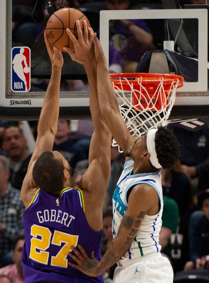 (Rick Egan  |  The Salt Lake Tribune)   Charlotte Hornets guard Malik Monk (1) is called for a personal foul, as he stops Utah Jazz center Rudy Gobert (27) from scoring, in NBA action between the Utah Jazz and the Charlotte Hornets, in Salt Lake City,  Monday, April 1, 2019.