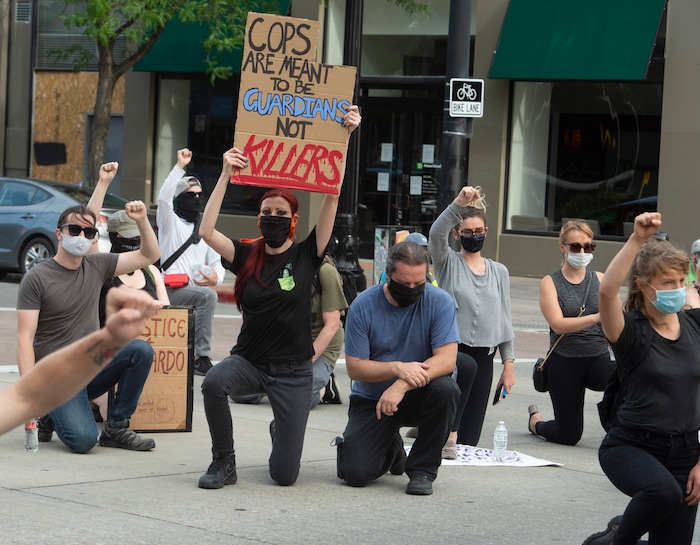 (Rick Egan  |  The Salt Lake Tribune)     Protesters stop and take a knee in remembrance of Bernardo  on Mains Street in Salt Lake City, during a Justice for Bernardo rally on Thursday, June 25, 2020.