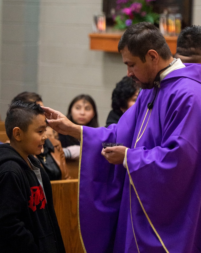 (Rick Egan | The Salt Lake Tribune) Alexander Ortega, 8, receives the ashes from the Rev. Jose Fidel Barrera-Cruz during Ash Wednesday Mass at Our Lady of Guadalupe Catholic Church in Salt Lake City on Wednesday, March 6, 2019.