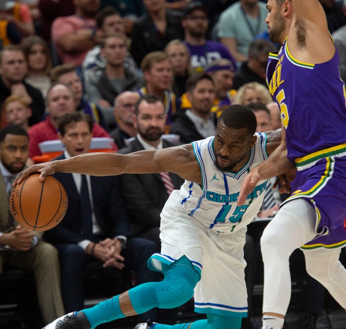 (Rick Egan  |  The Salt Lake Tribune)   Charlotte Hornets guard Kemba Walker (15) tries to get past Utah Jazz guard Raul Neto (25), in NBA action between the Utah Jazz and the Charlotte Hornets, in Salt Lake City,  Monday, April 1, 2019.