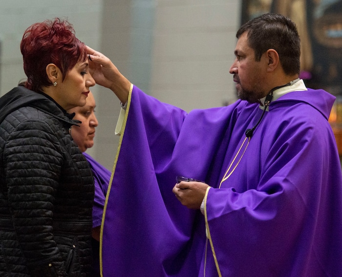 (Rick Egan | The Salt Lake Tribune) Diana Rivas receives the ashes from the Rev. Jose Fidel Barrera-Cruz during Ash Wednesday Mass at Our Lady of Guadalupe Catholic Church in Salt Lake City on Wednesday, March 6, 2019.