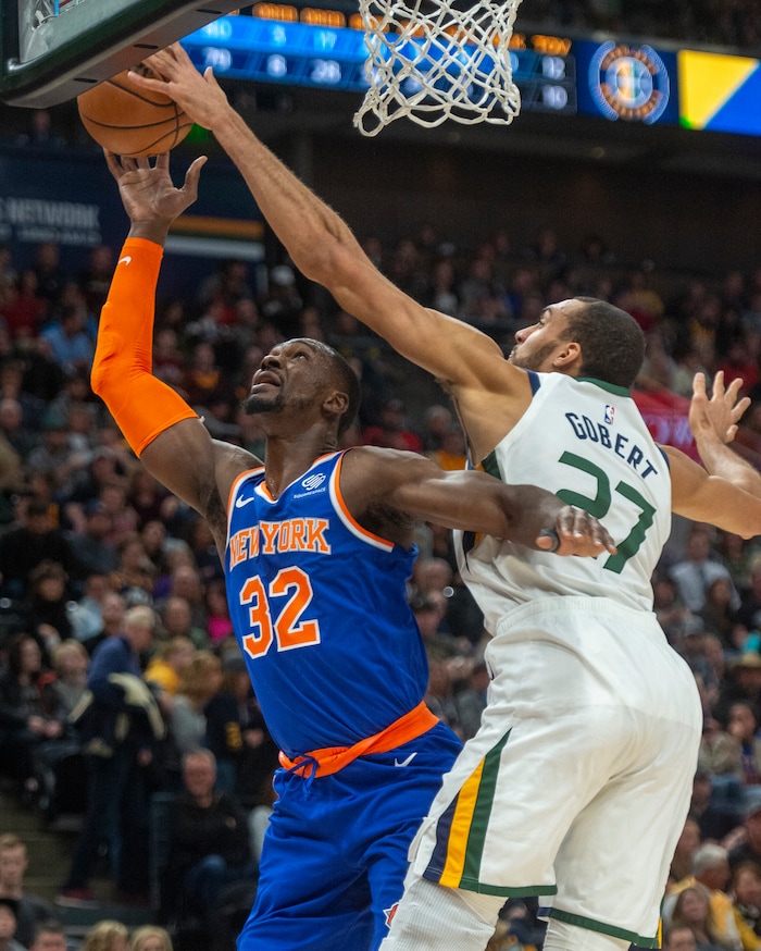(Rick Egan  |  The Salt Lake Tribune)    Utah Jazz center Rudy Gobert (27) blocks a shot by New York Knicks forward Noah Vonleh (32), in NBA action between Utah Jazz and New York Knicks, in Salt Lake City, Saturday, Dec. 29, 2018.