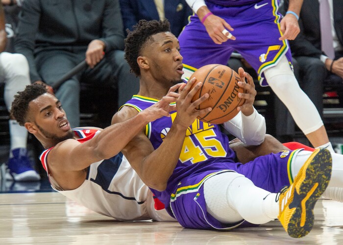 (Rick Egan  |  The Salt Lake Tribune)        Washington Wizards forward Troy Brown Jr. (6) goes for a loose ball along with Utah Jazz guard Donovan Mitchell (45), in NBA action between the Utah Jazz and the Washington Wizards, in Salt Lake City, Friday, March 29, 2019.