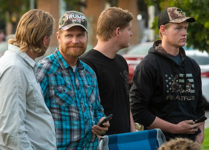 (Rick Egan  |  The Salt Lake Tribune)     Several people carried guns, but no one was wearing masks, as a couple of hundred people gather at the Provo Courthouse for the Utah County Freedom Rally on Friday, Oct. 2, 2020.