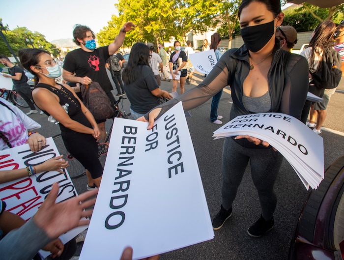 (Rick Egan  |  The Salt Lake Tribune)      Protesters grab signs to put up in their neighborhoods, during a Justice for Bernardo demonstration, in Salt Lake City, Tuesday, July 7, 2020.