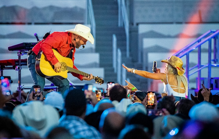 (Isaac Hale | Special to The Tribune) Garth Brooks interacts with a fan as he performs with his band during a stop on their stadium tour held at Rice-Eccles Stadium in Salt Lake City on Saturday, July 17, 2021.