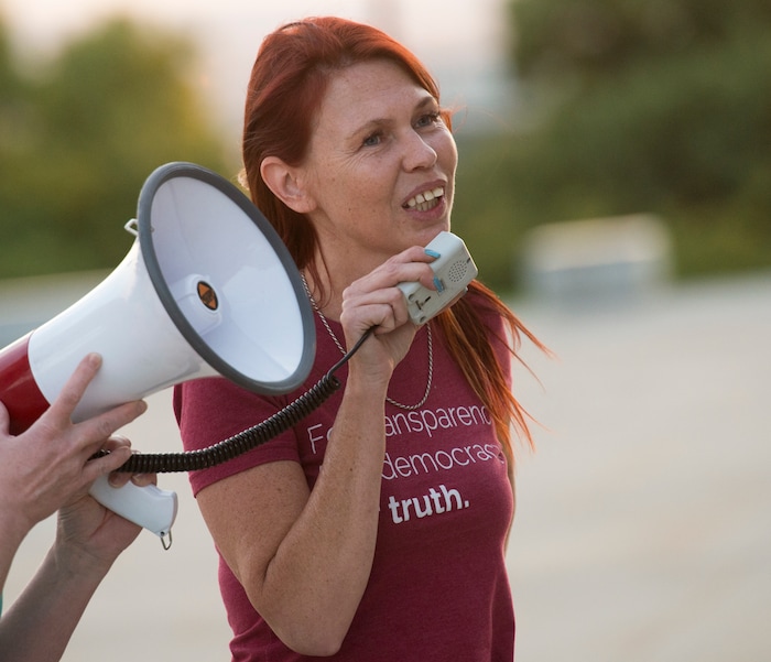 (Rick Egan  |  The Salt Lake Tribune)     Jamie Carter leads a chant at the Confront Corruption:Demand Democracy vigil on the steps of the Utah State Capitol, Wednesday. Salt Lake City joined more than 110 vigils nationwide to stand against corruption in the United States, July 18, 2018.