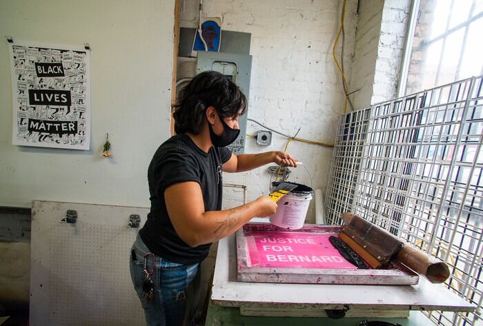 (Rick Egan  |  The Salt Lake Tribune)     Volunteer Taylar Jackson, makes silk screen prints for protest posters,Wednesday, June 30, 2020.