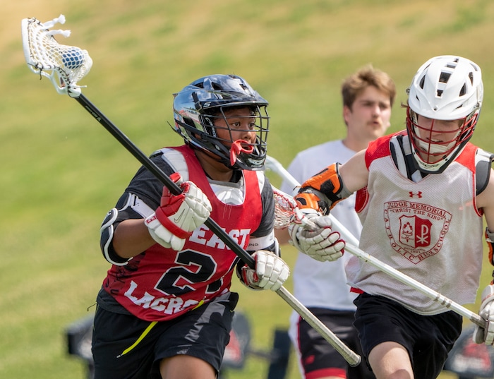 (Rick Egan | The Salt Lake Tribune)  Edward Tonga runs towards the goal, during East youth lacrosse practice, on Wednesday, June 22, 2022.