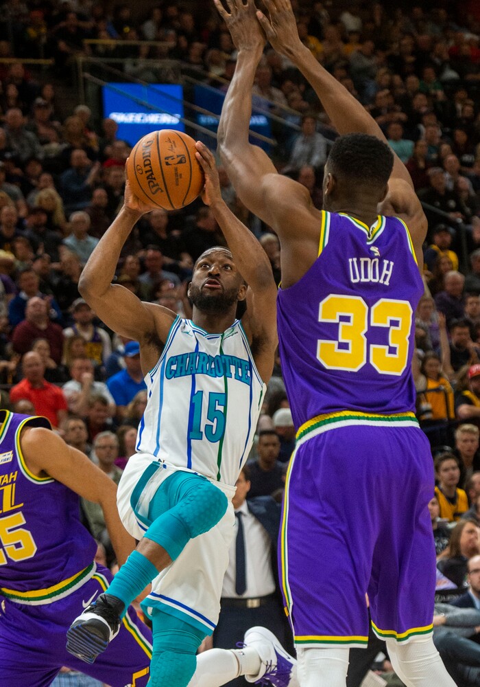 (Rick Egan  |  The Salt Lake Tribune)   Charlotte Hornets guard Kemba Walker (15) shoots as Utah Jazz center Ekpe Udoh (33) defends, in NBA action between the Utah Jazz and the Charlotte Hornets, in Salt Lake City,  Monday, April 1, 2019.