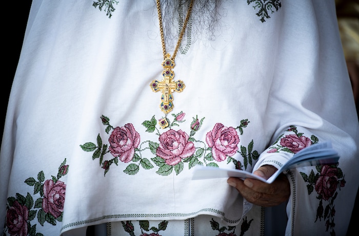 (Isaac Hale | Special to The Tribune) A clergy member reads during a consecration service for St. Xenia Orthodox Church in Payson on Saturday, July 16, 2022.