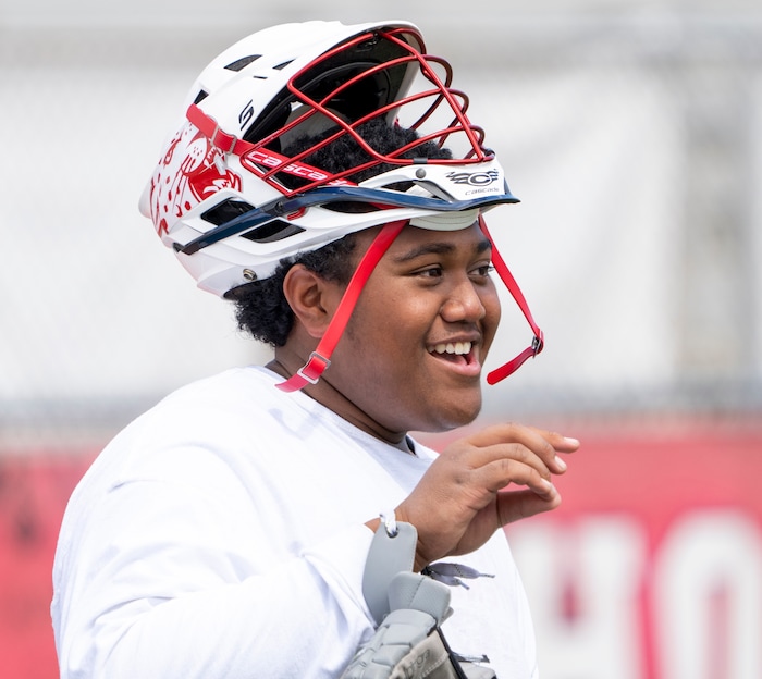(Rick Egan | The Salt Lake Tribune)  Tui Tonga jokes with teammates, during  East youth lacrosse practice, on Wednesday, June 22, 2022.